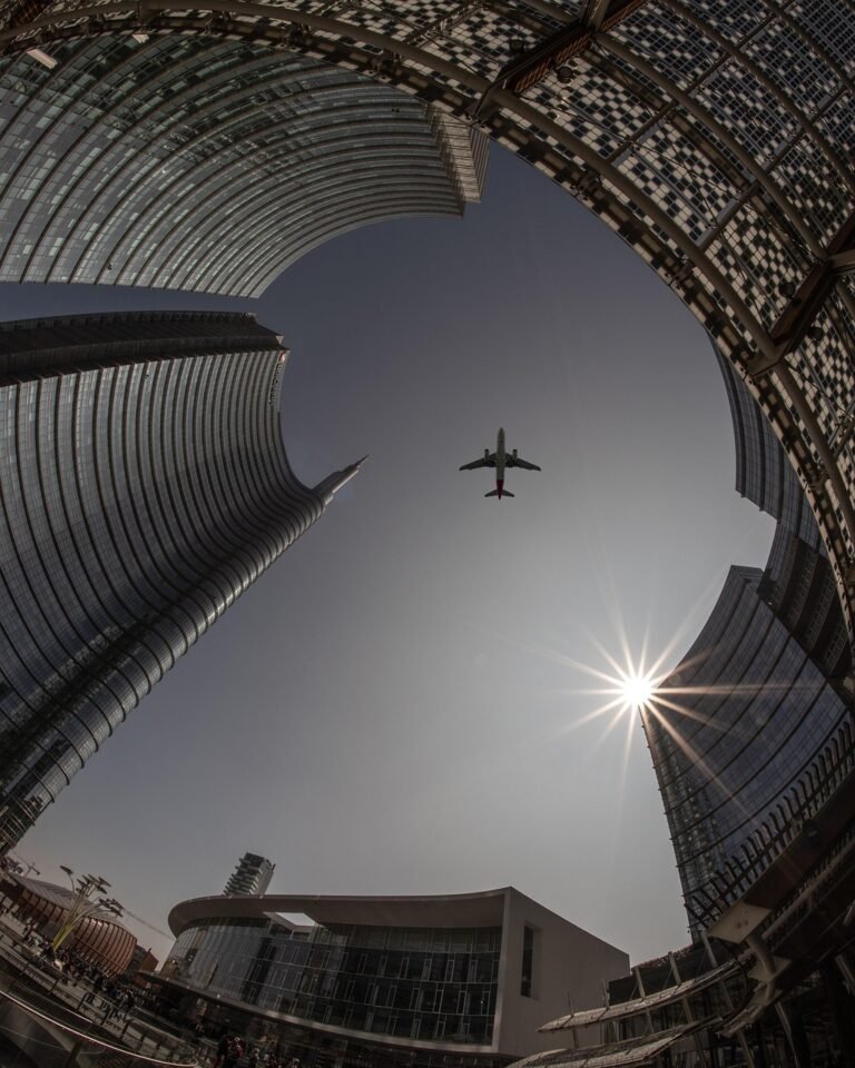 plane, city, architecture, sky, airplane, flight, travel, sun, urban, buildings, tourism, outdoors, transportation, cityscape, skyline, tower, nature, skyscrapers, lookup, aircraft